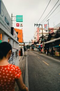 Captivating view of a lively street in Bangkok, showcasing local architecture and urban life.